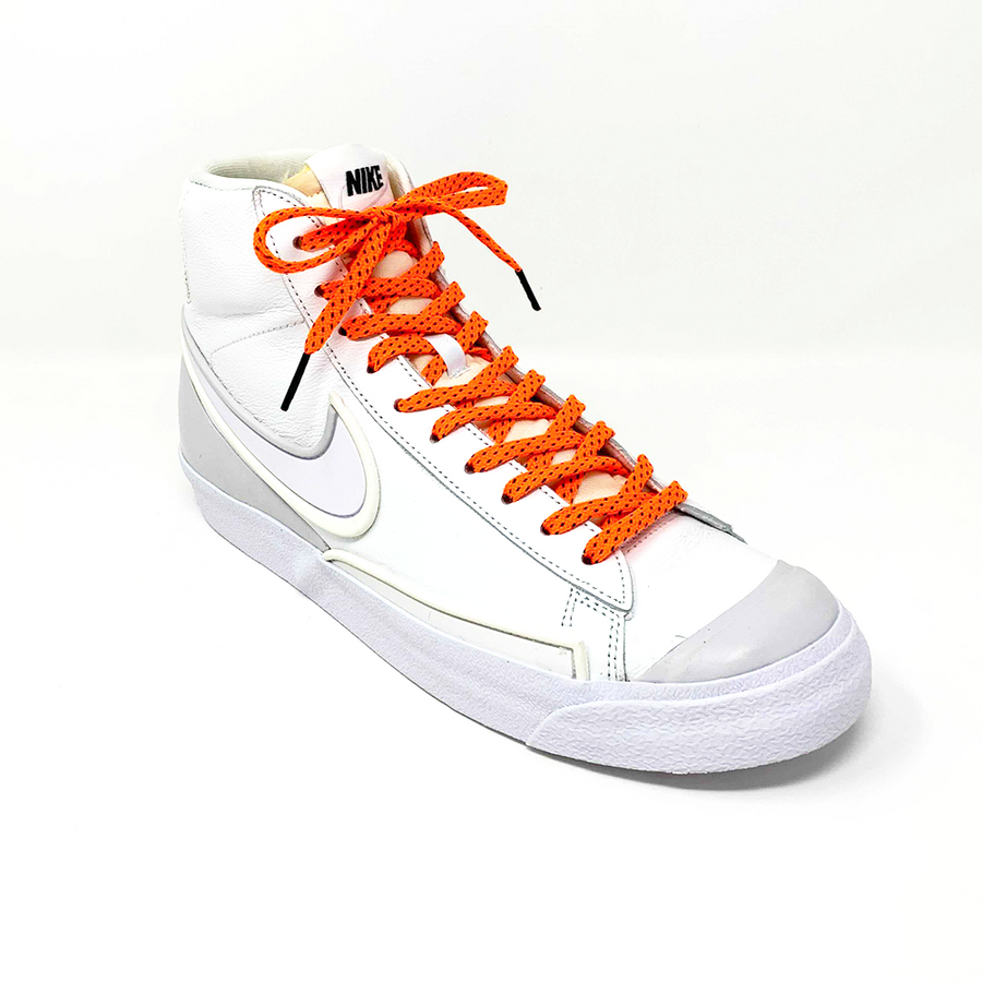 Neon Orange & Navy ticked flat shoelaces laced into a white high-top sneaker