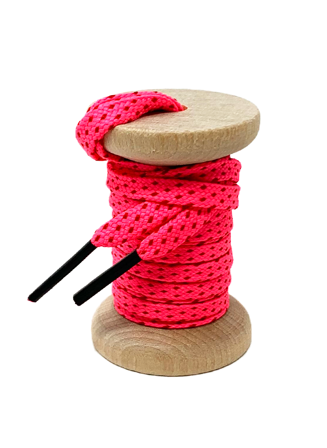 Neon Pink & Red ticked flat shoelaces on a wooden spool