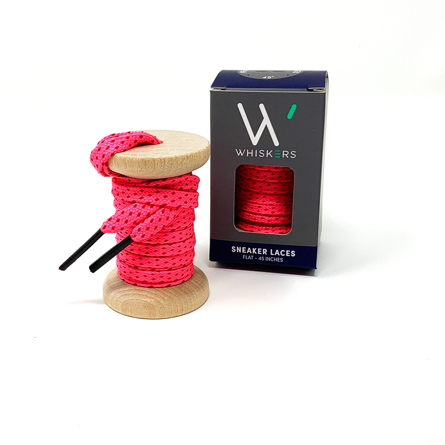 Neon Pink & Red ticked flat shoelaces on a wooden spool beside the retail box