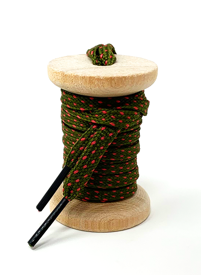 Olive Green & Guava ticked flat shoelaces on a wooden spool