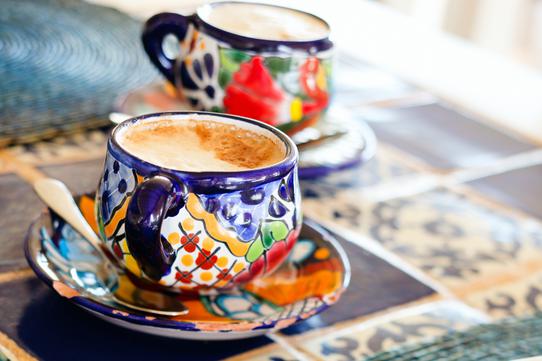 Two patterned coffee cups pictured as a serving suggestion for Mexico Soconusco coffee