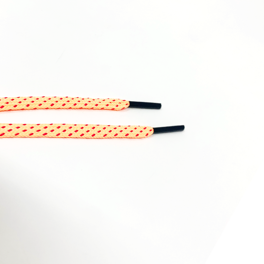 Peach & Fuchsia ticked flat shoelaces close-up of flat lace ends and black aglets