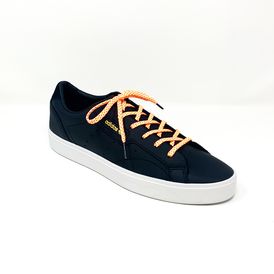Peach & Fuchsia ticked flat shoelaces laced into a black low-top sneaker