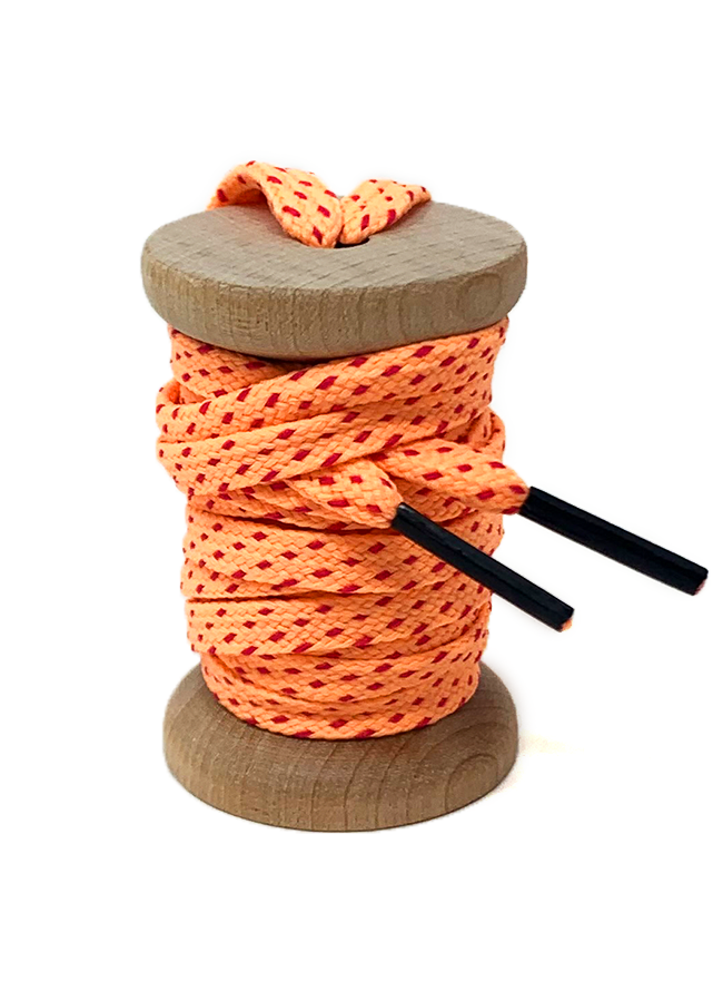 Peach & Fuchsia ticked flat shoelaces on a wooden spool