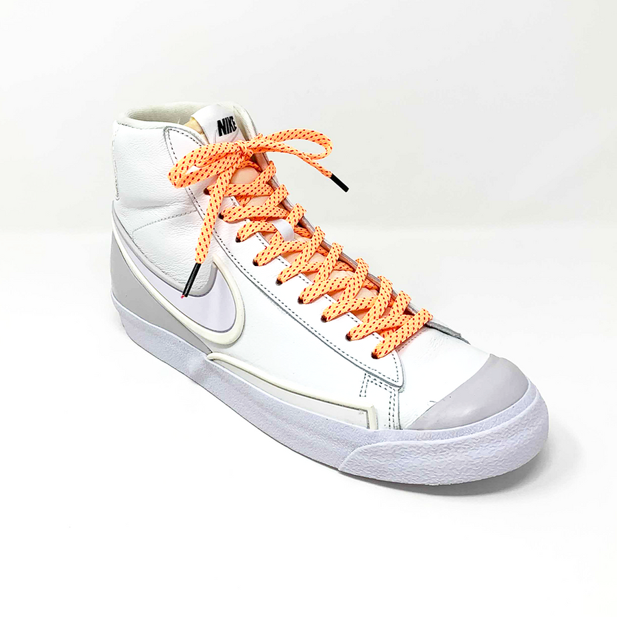 Peach & Fuchsia ticked flat shoelaces laced into a white high-top sneaker