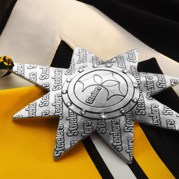 Styled display featuring Pittsburgh Steelers Solstice Star Collector's Ornament