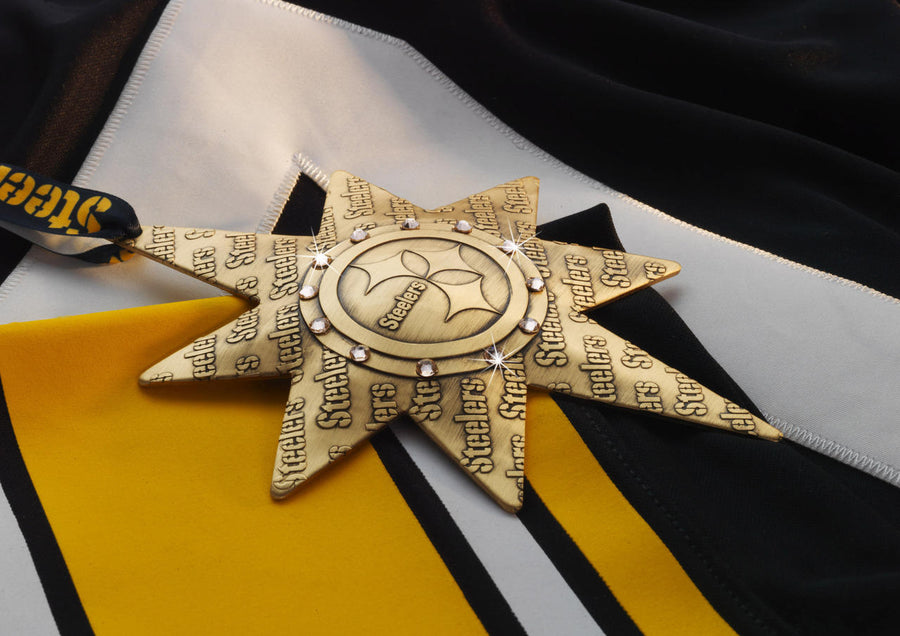 Styled display featuring Pittsburgh Steelers Solstice Star Collector's Ornament