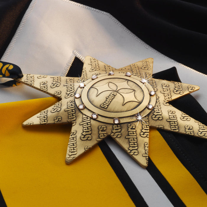 Styled display featuring Pittsburgh Steelers Solstice Star Collector's Ornament
