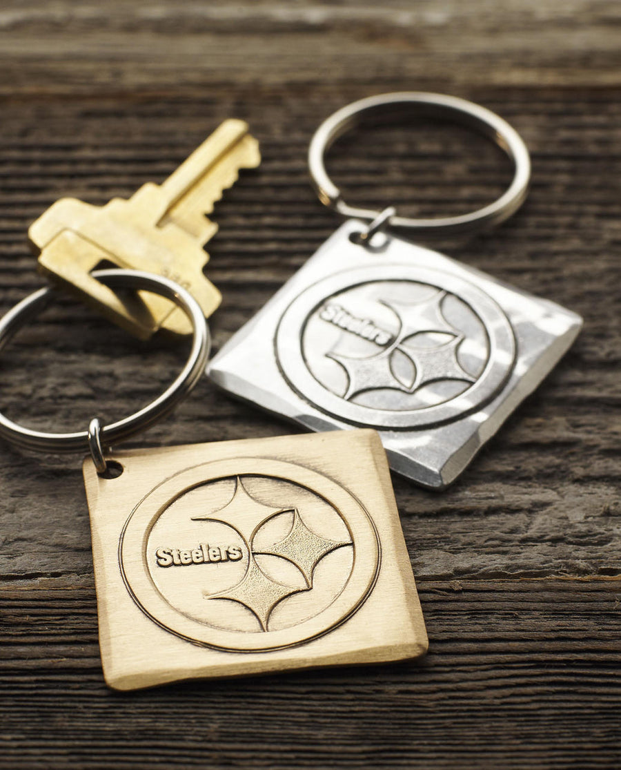 Collection display featuring Pittsburgh Steelers Logo Key Chain