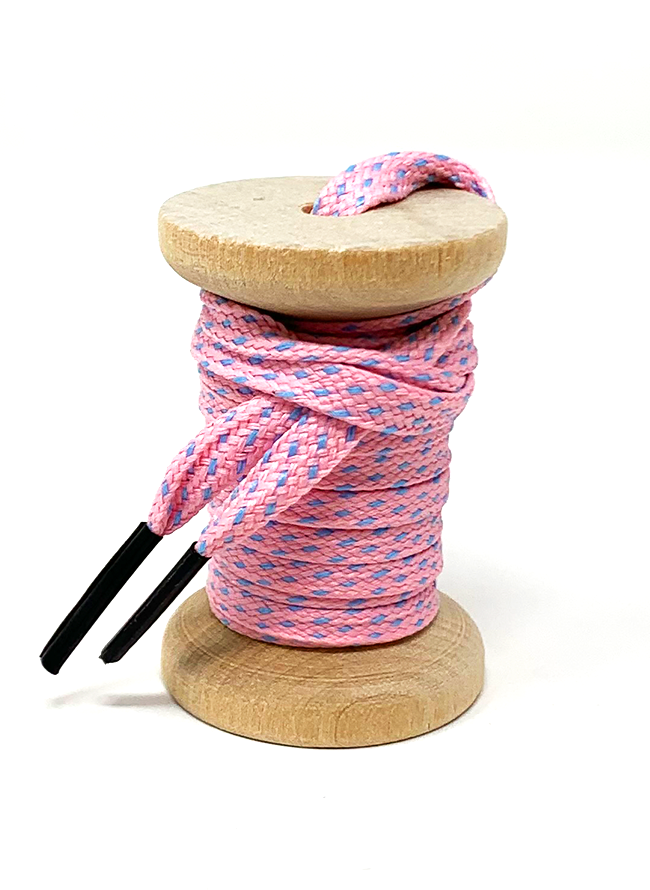 Pink & Light Blue ticked flat shoelaces on a wooden spool
