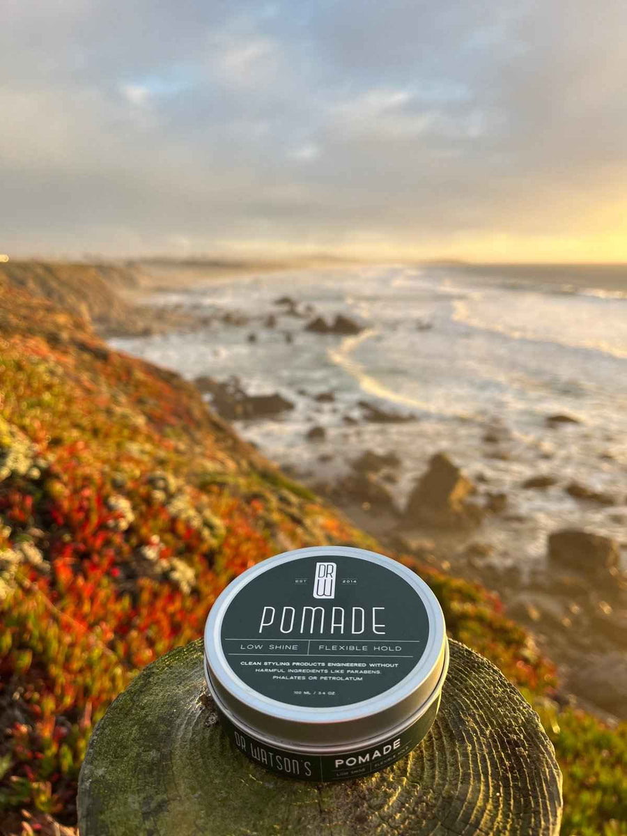 Pomade jar overlooking the ocean at sunset