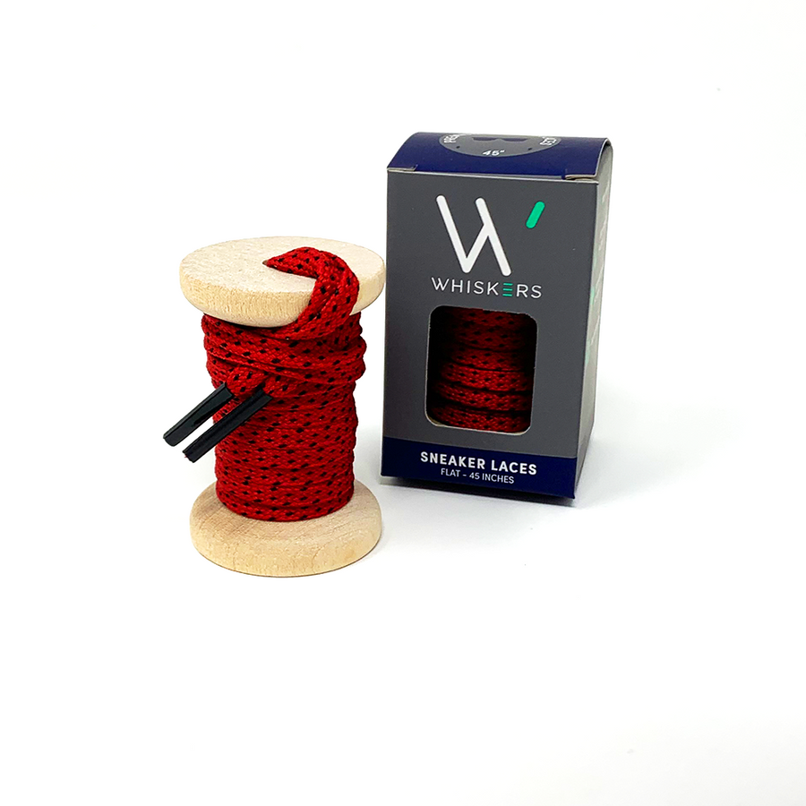 Red & Black ticked flat shoelaces on a wooden spool beside the retail box