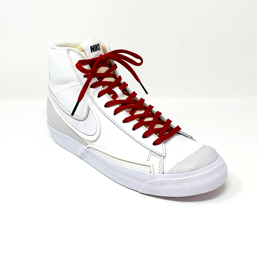 Red & Black ticked flat shoelaces laced into a white high-top sneaker