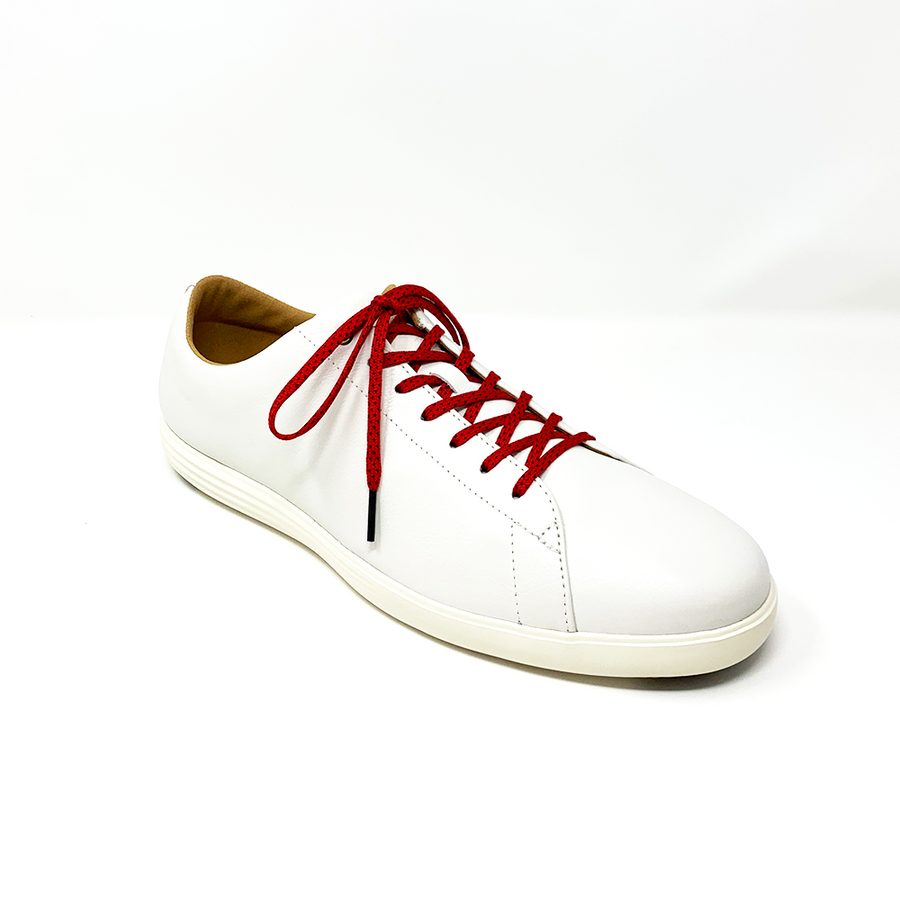 Red & Black ticked flat shoelaces laced into a cream low-top sneaker