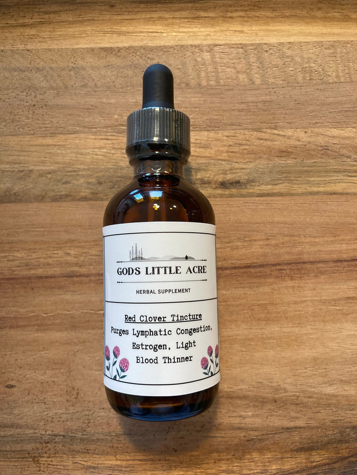 Red Clover Tincture in its amber glass bottle with dropper with supplier branding