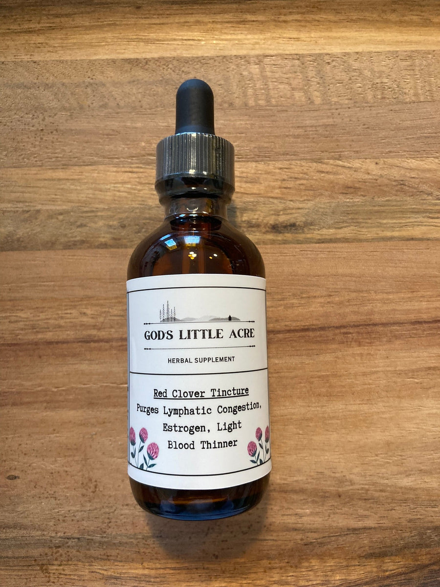 Red Clover Tincture in its amber glass bottle with dropper with supplier branding