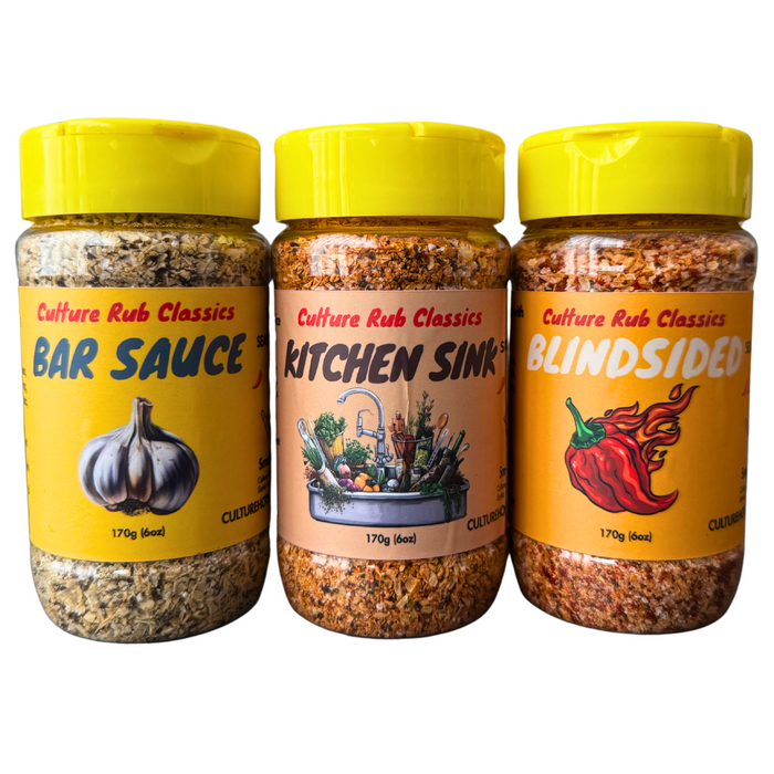 Three yellow-cap seasoning jars shown as Bar Sauce, Kitchen Sink and Blindsided; third jar differs from current maker description