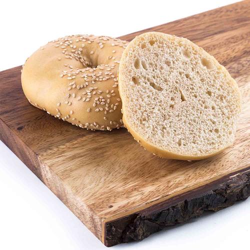 Sesame Low Carb Bagels: sliced sesame bagel on a cutting board.