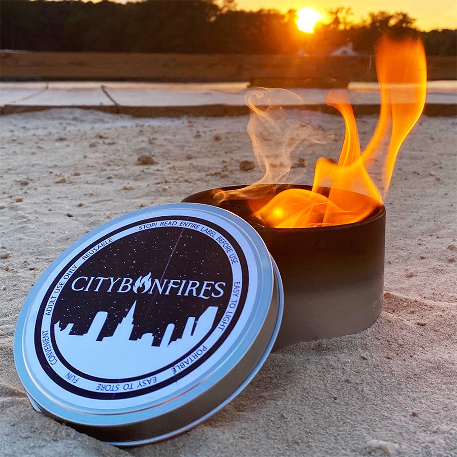 Portable bonfire and lid at sunset