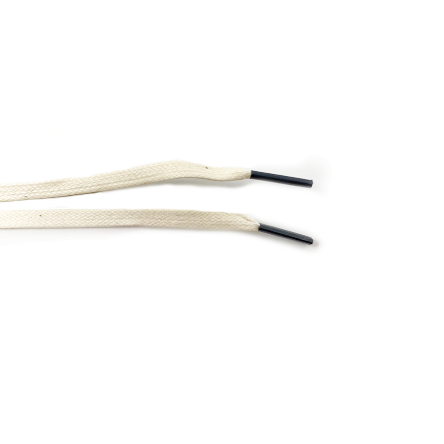 Cream glazed cotton shoelaces close-up of flat cotton lace ends and black aglets