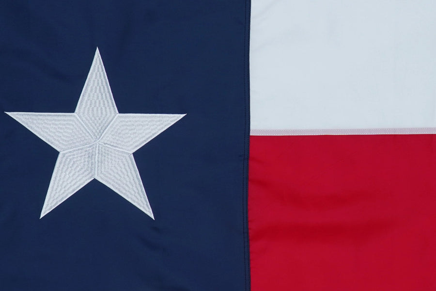 Texas state flag close-up with white star blue field and red white stripes