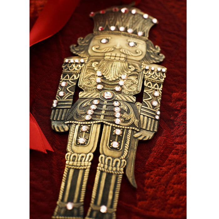 Styled display featuring Nutcracker Prince Christmas Ornament - Bronze