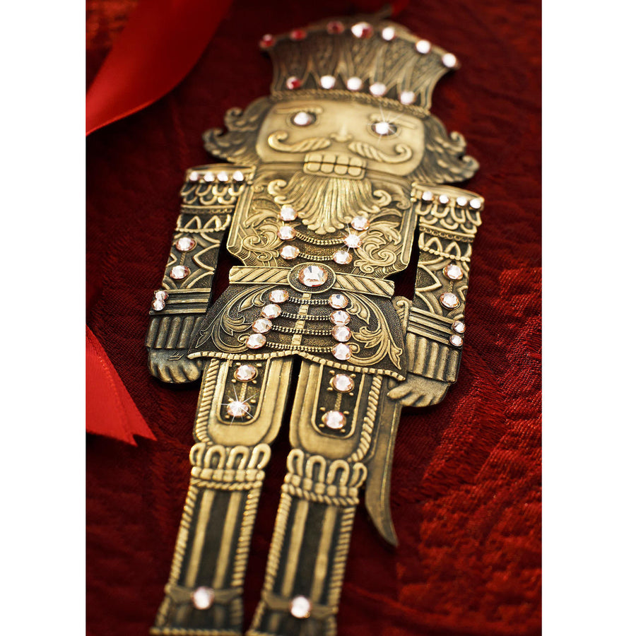 Styled display featuring Nutcracker Prince Christmas Ornament - Bronze