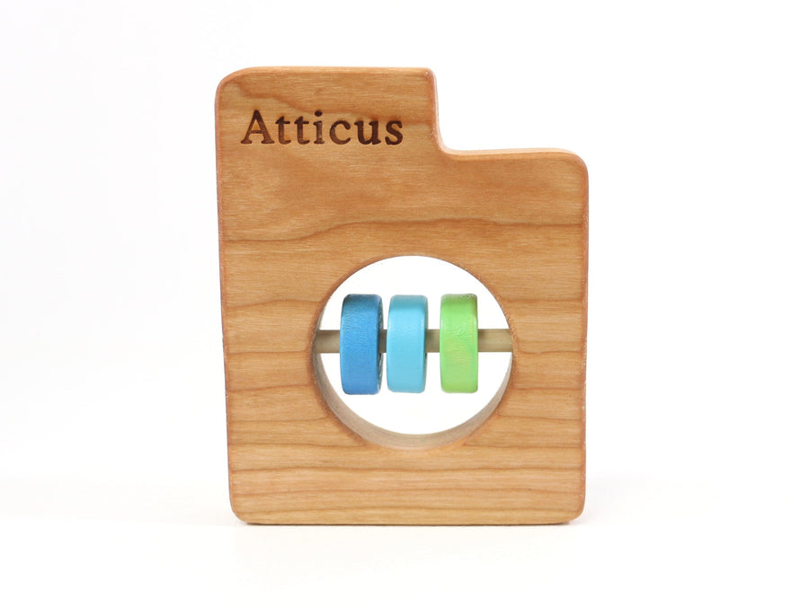 Utah cherry wood rattle with an example of engraved personalization