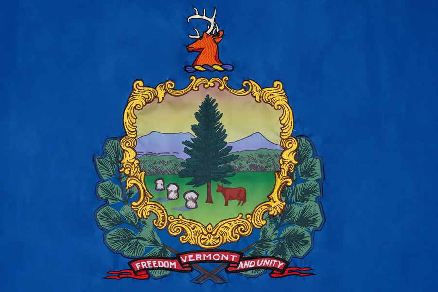 Vermont state flag close-up with coat of arms and Freedom and Unity motto