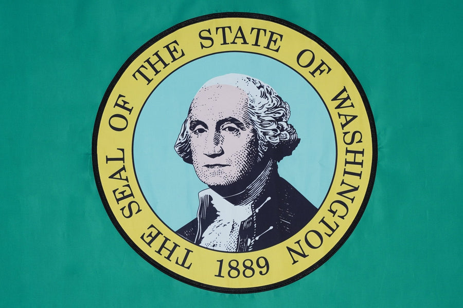 Washington state flag close-up with George Washington portrait on green field