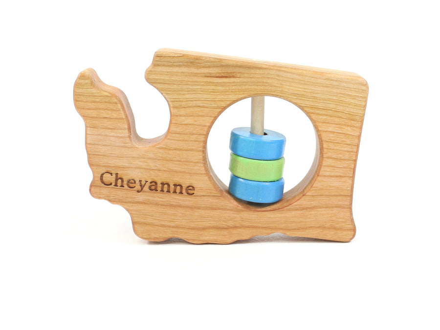 Washington state-shaped cherry wood baby rattle with colored center disks