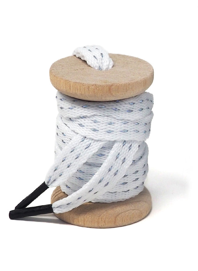 White reflective shoelaces on a wooden spool